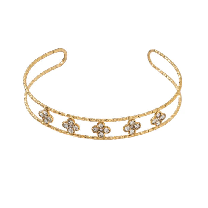 Gouden armband met klavertje.